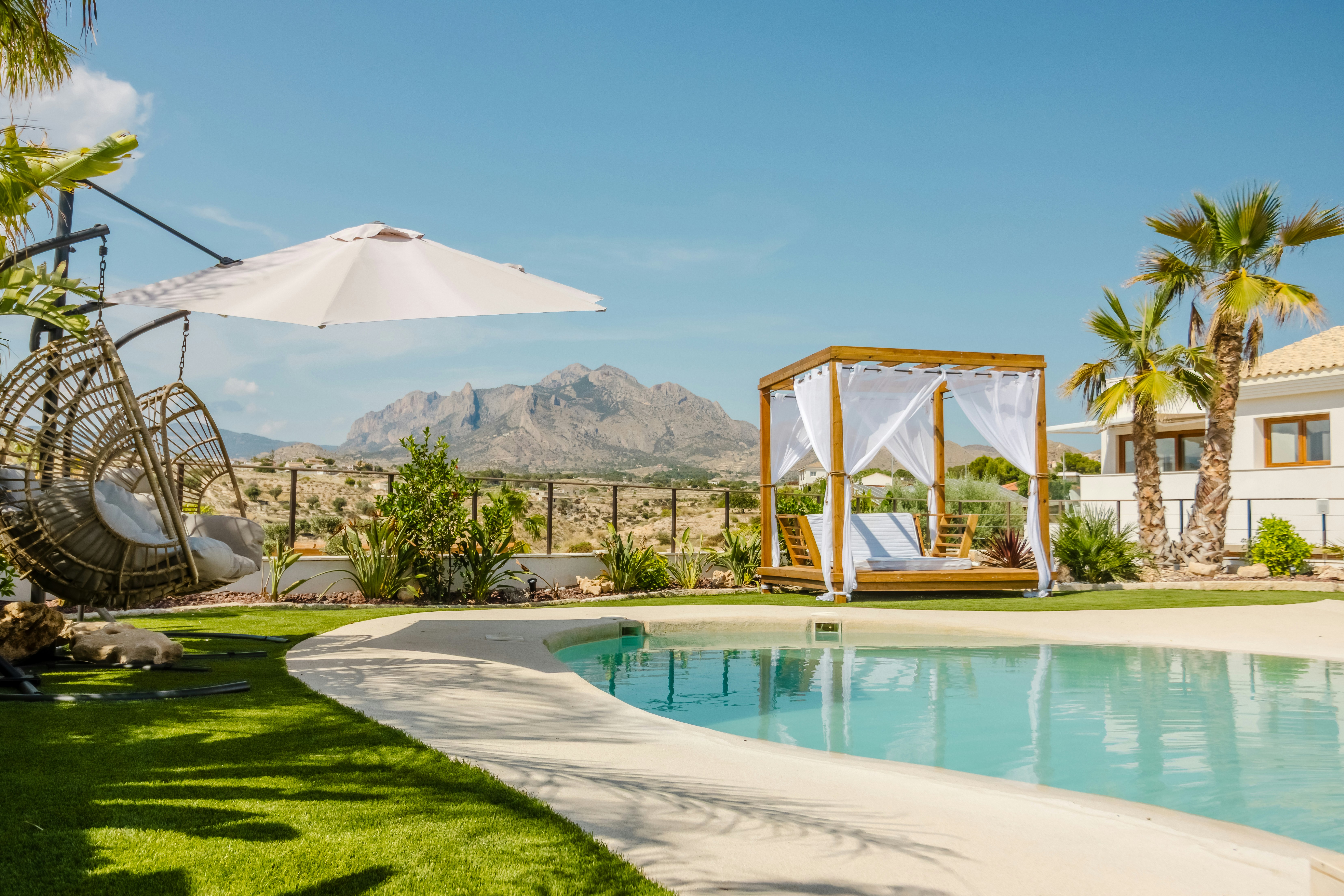 Resort pool area with mountains in the background.
