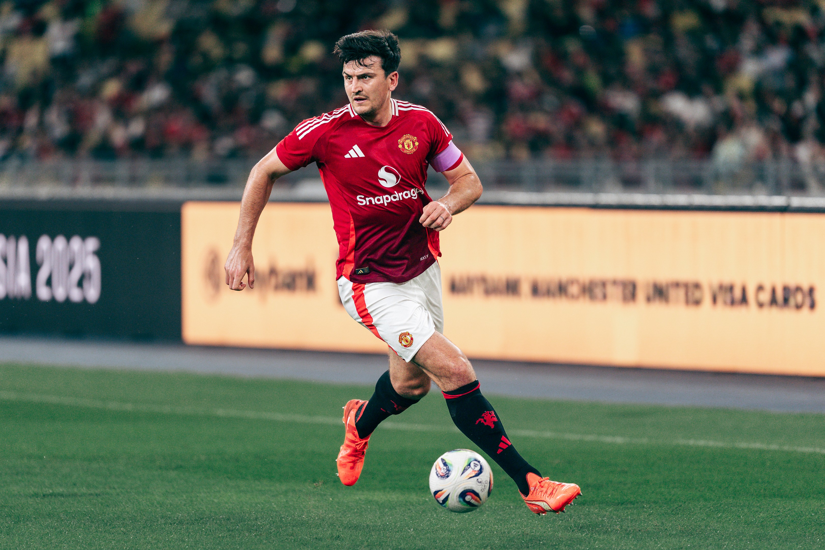 Harry Maguire in action at the Maybank Challenge Cup 2025 match between Manchester United and the ASEAN All Stars