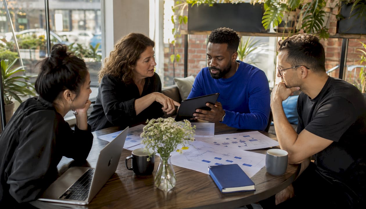 Startup team discussing event-driven architecture