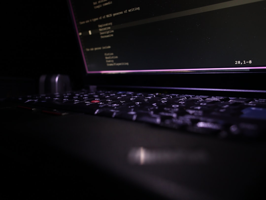 Close-up of a laptop keyboard in the dark