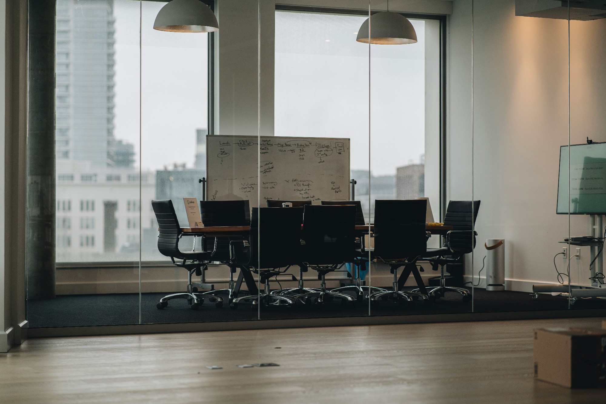 empty board room through glass wall