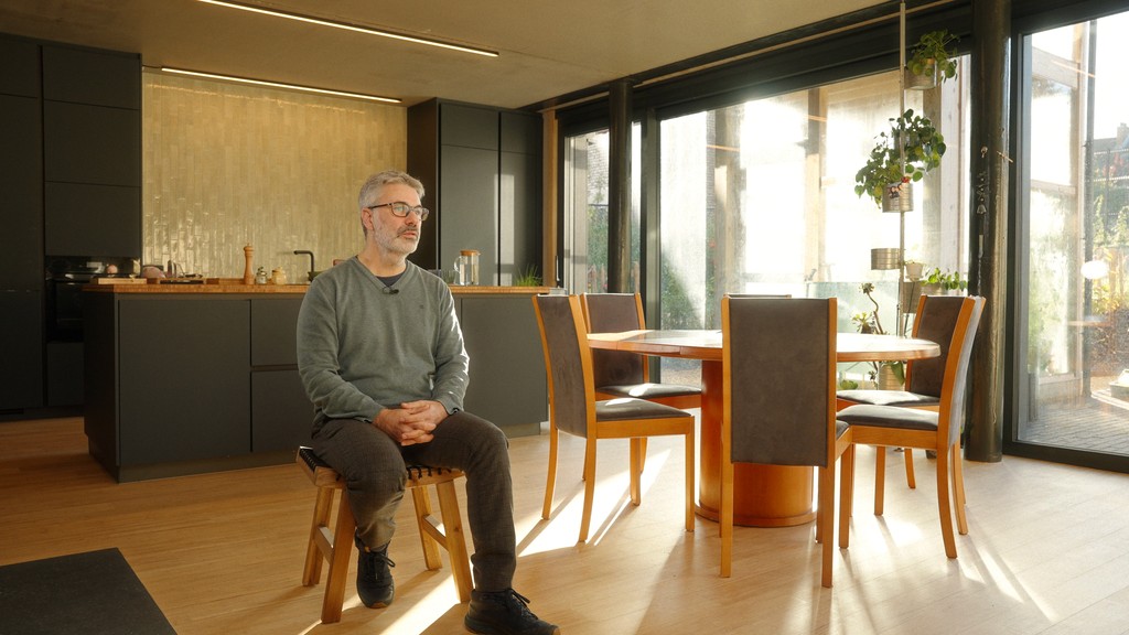 Interview of a man sitting in a modern living room