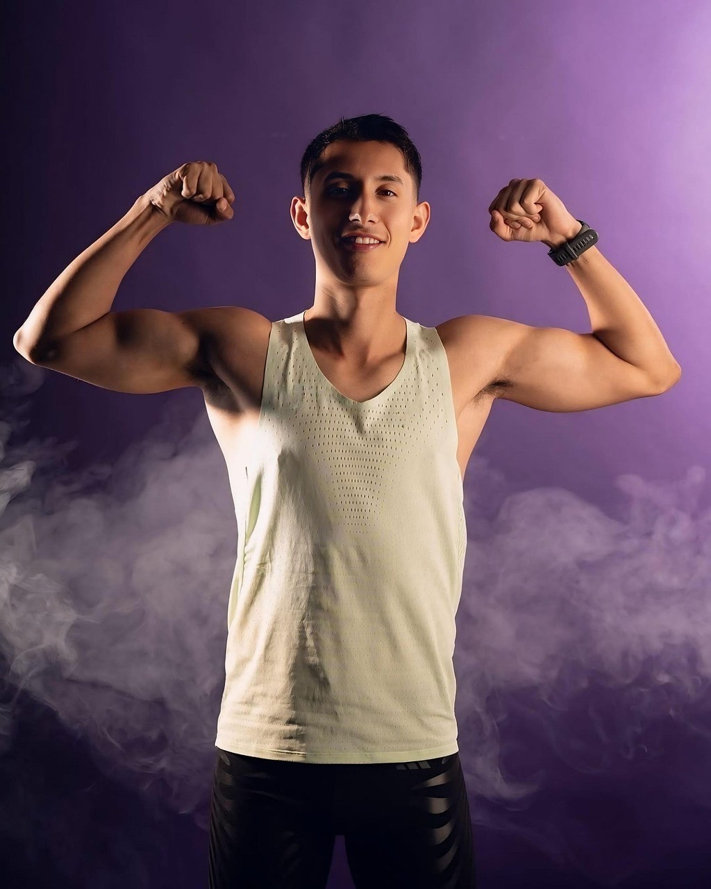 man in white sweater holding round mirror