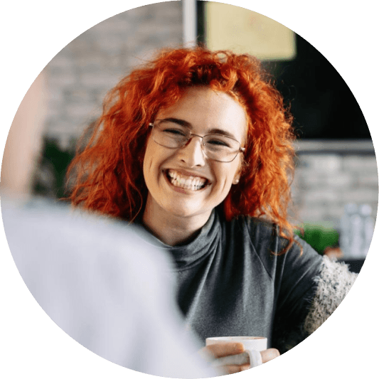 Girl smiling with coffee mug