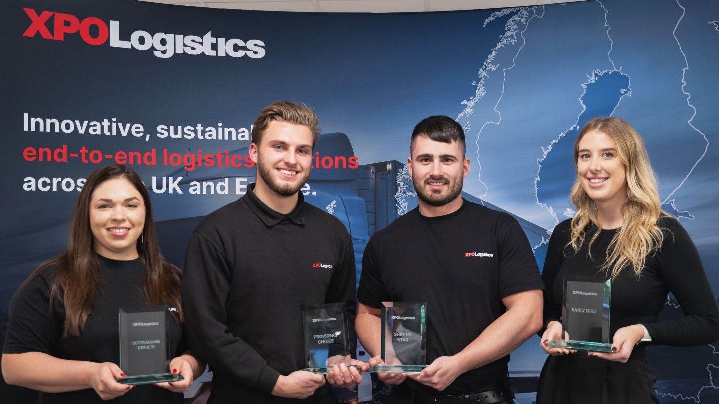 Apprentices receiving awards on stage at the XPO Logistics Apprenticeship Awards Ceremony.