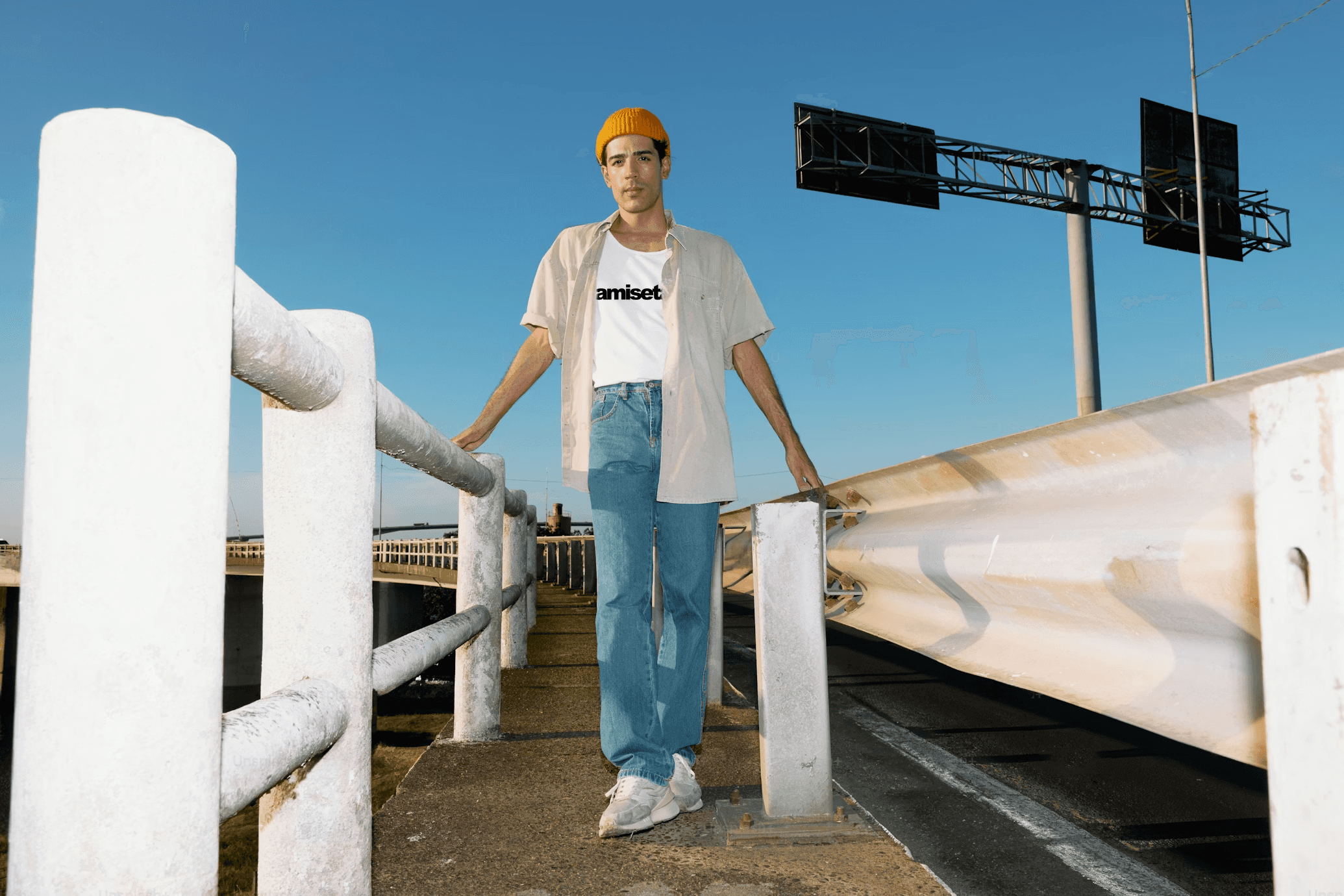 Close-up of stylish women’s chunky sneakers in soft green, beige, and orange tones, worn by a woman indoors with bright natural lighting.