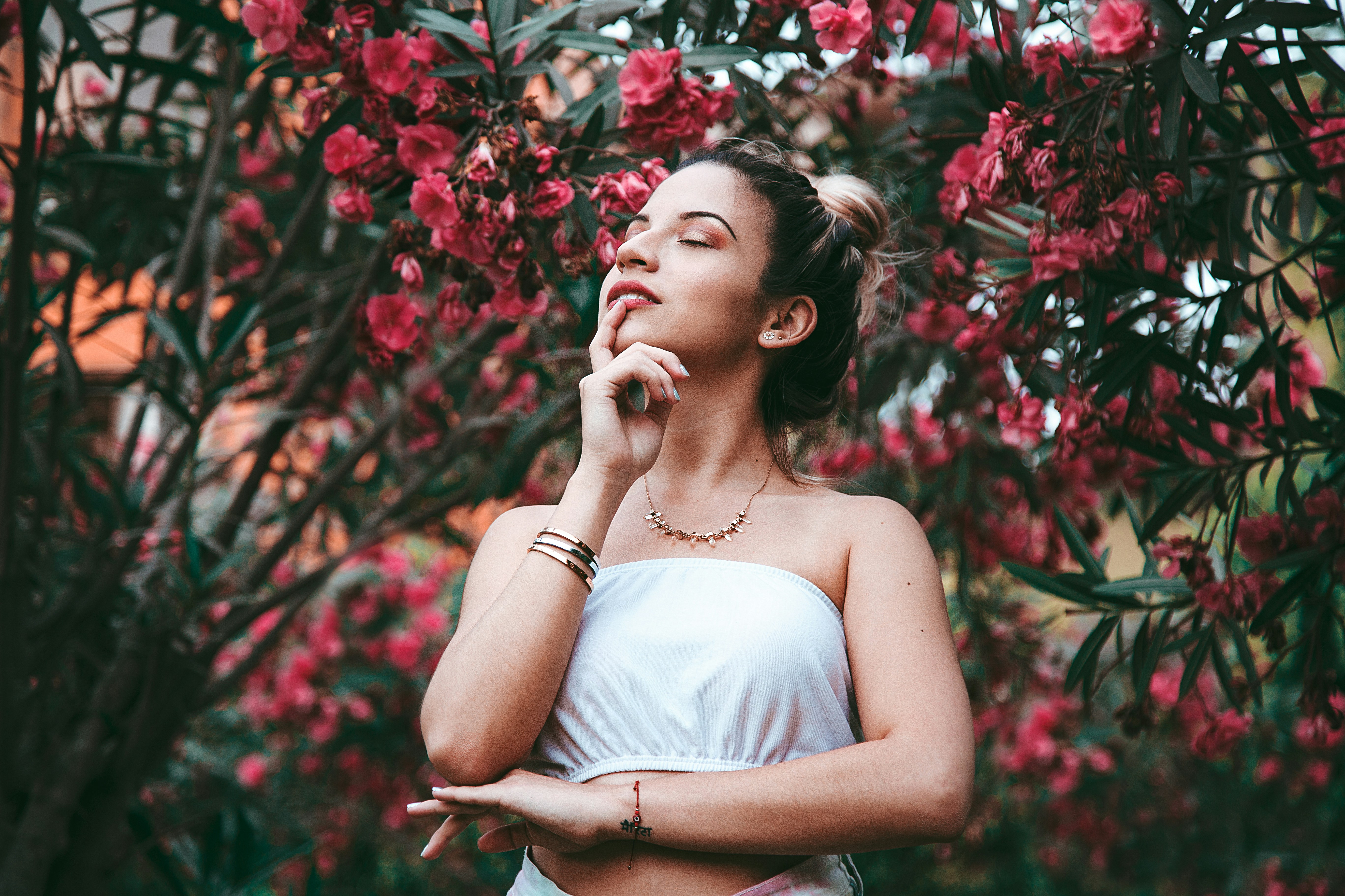 woman thinking about What Colors Look Good on Pale Skin with Pink Undertones