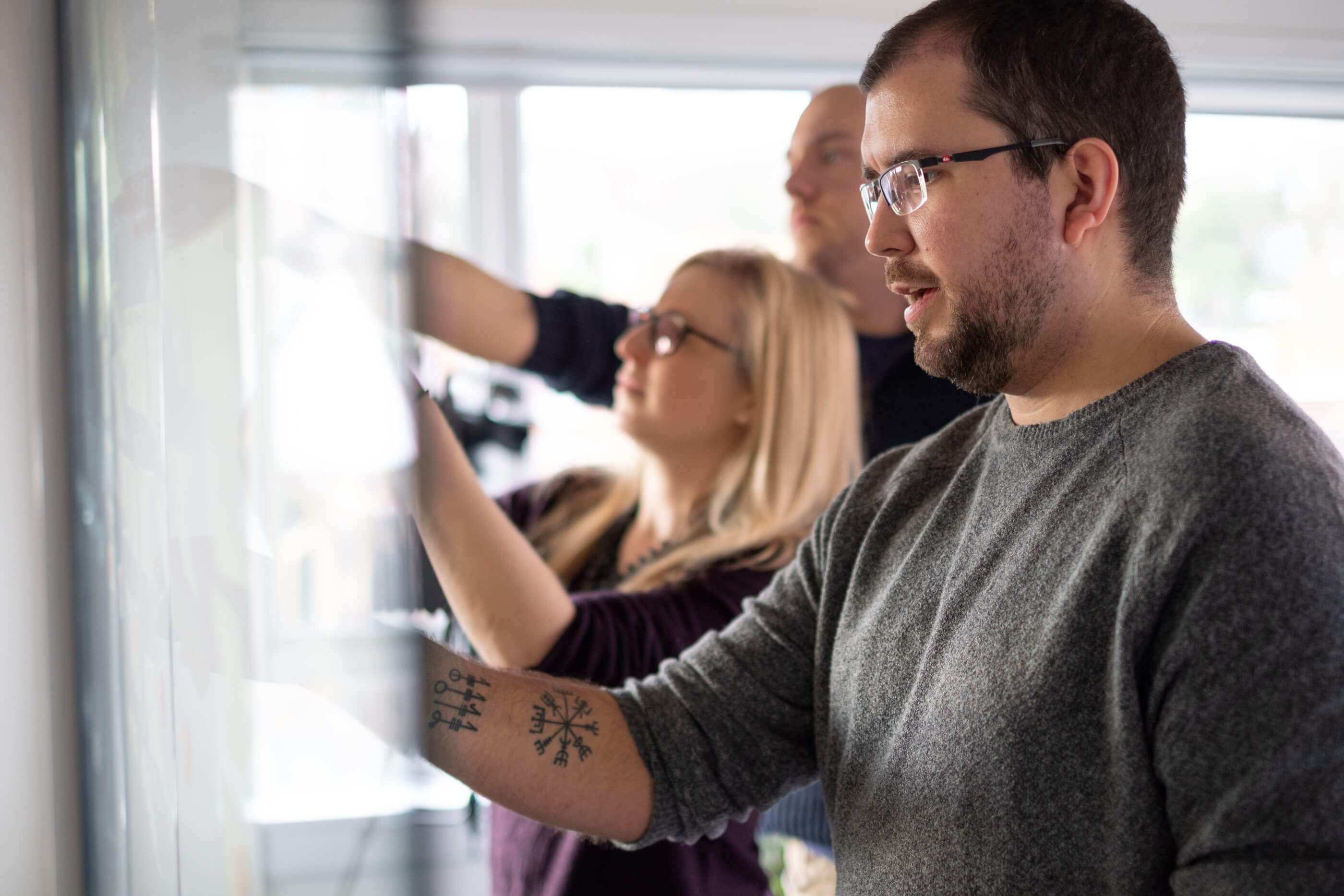 Hero image featuring a greyscaled communication platform on an abstract background.