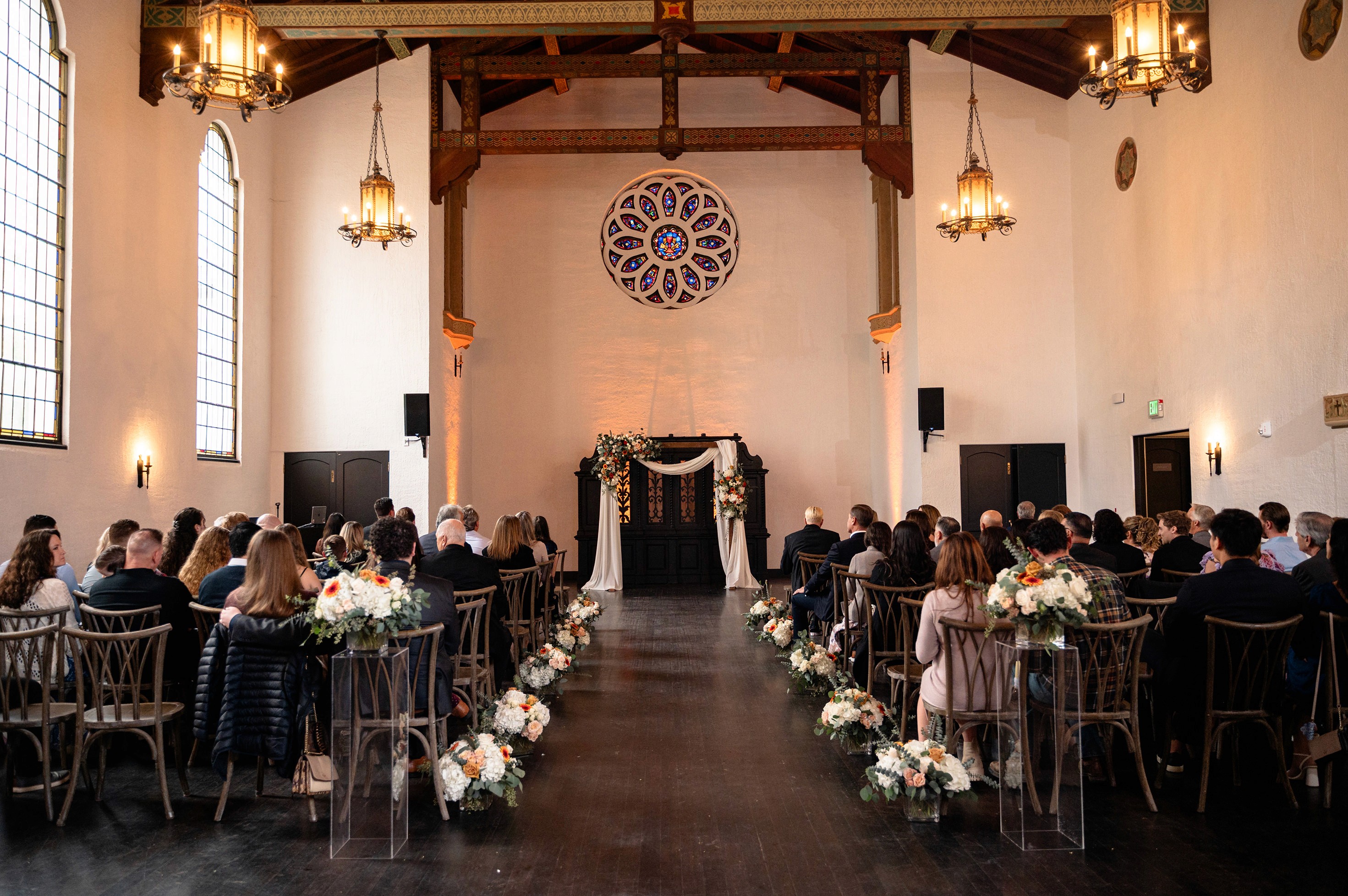 Flat lay wedding details with bouquet, rings, and sparkling bridal heels
