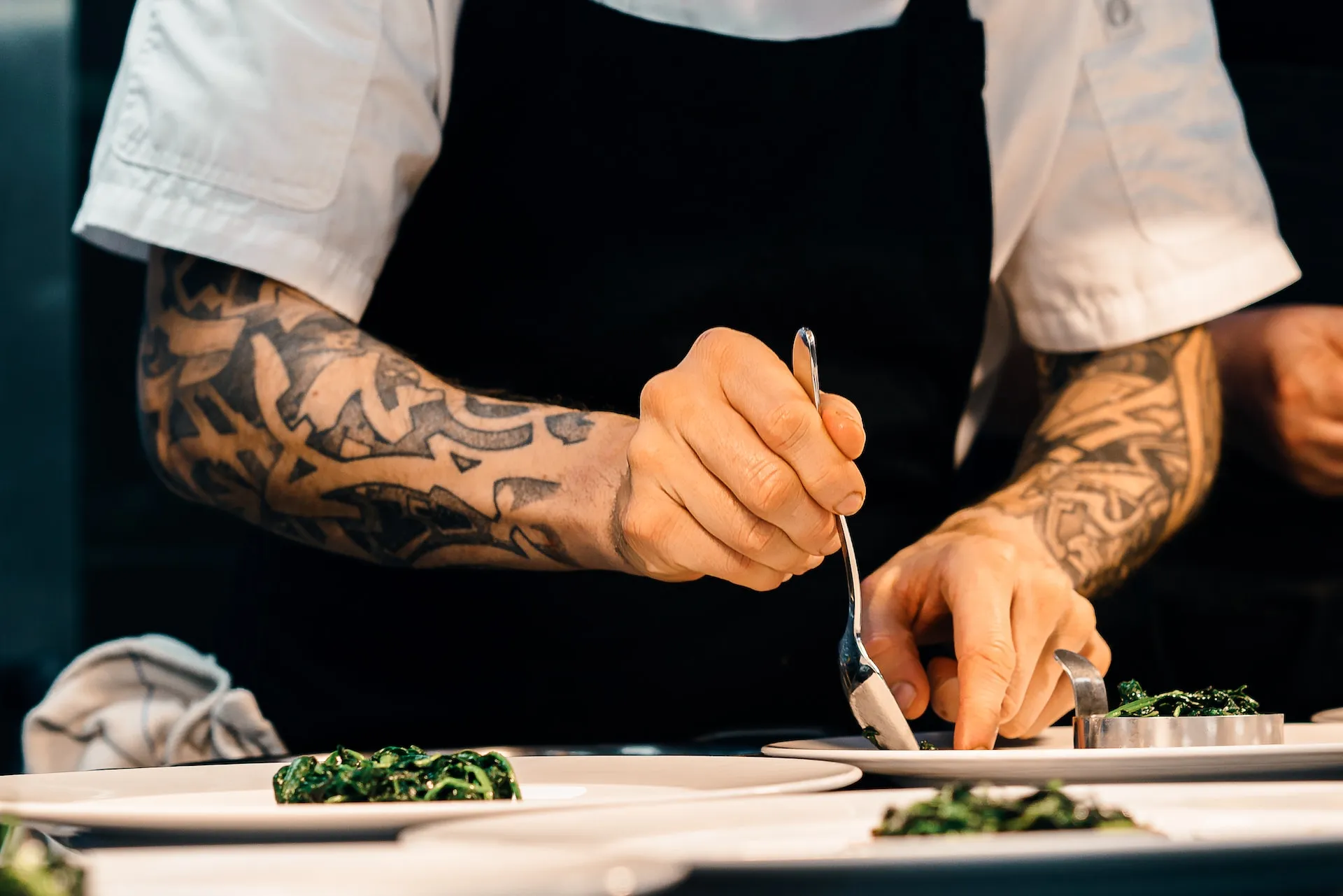 Chef aranging food on a plate