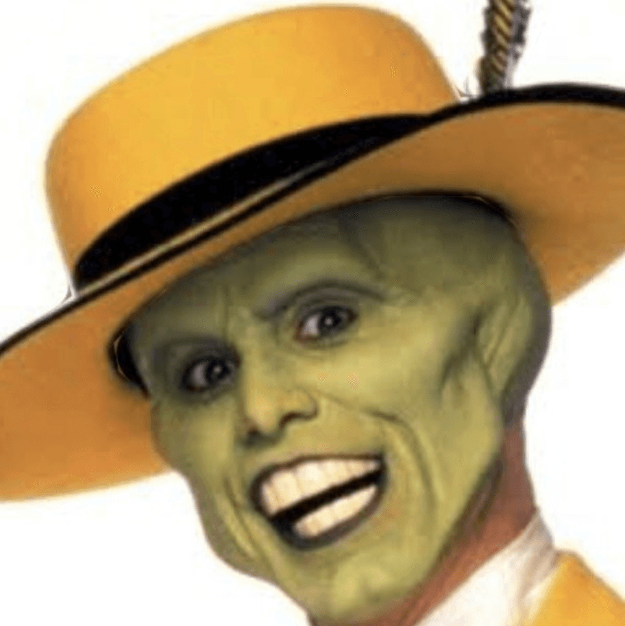 a man with a goatee smiles at the camera