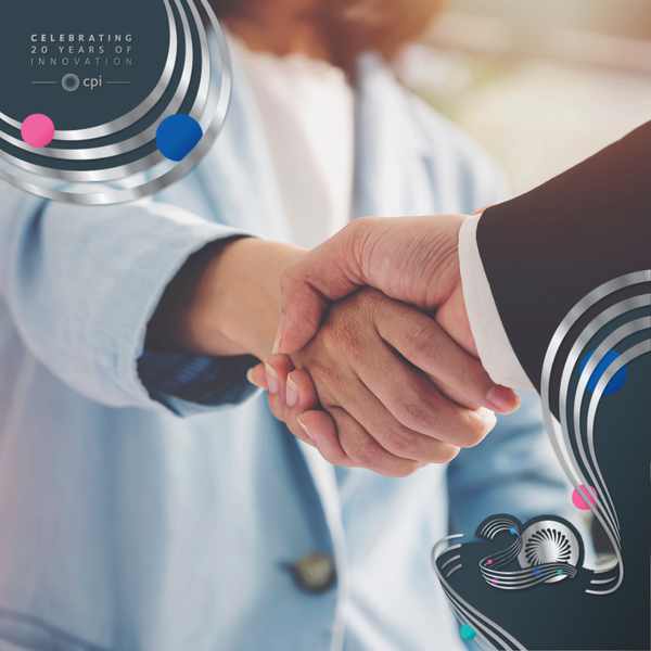 A close-up shot of a handshake between a man and woman.