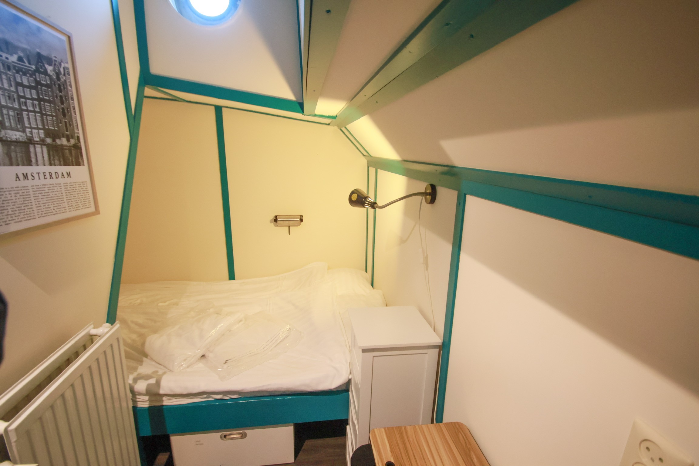 Classic bedroom with canopy bed and patterned pillows