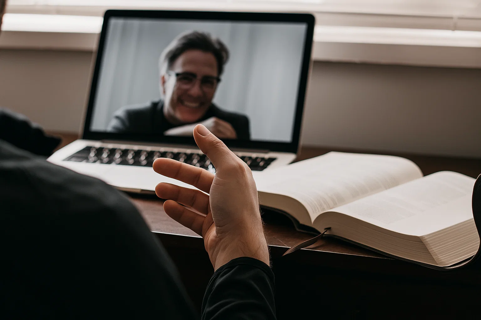 person in red and black plaid long sleeve shirt using black laptop computer