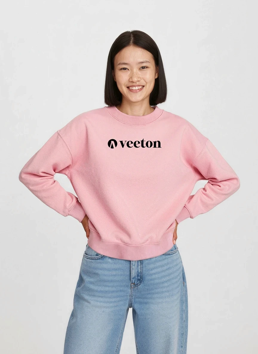 Virtual fashion model with wavy hair wearing pink Veeton sweatshirt and light blue jeans