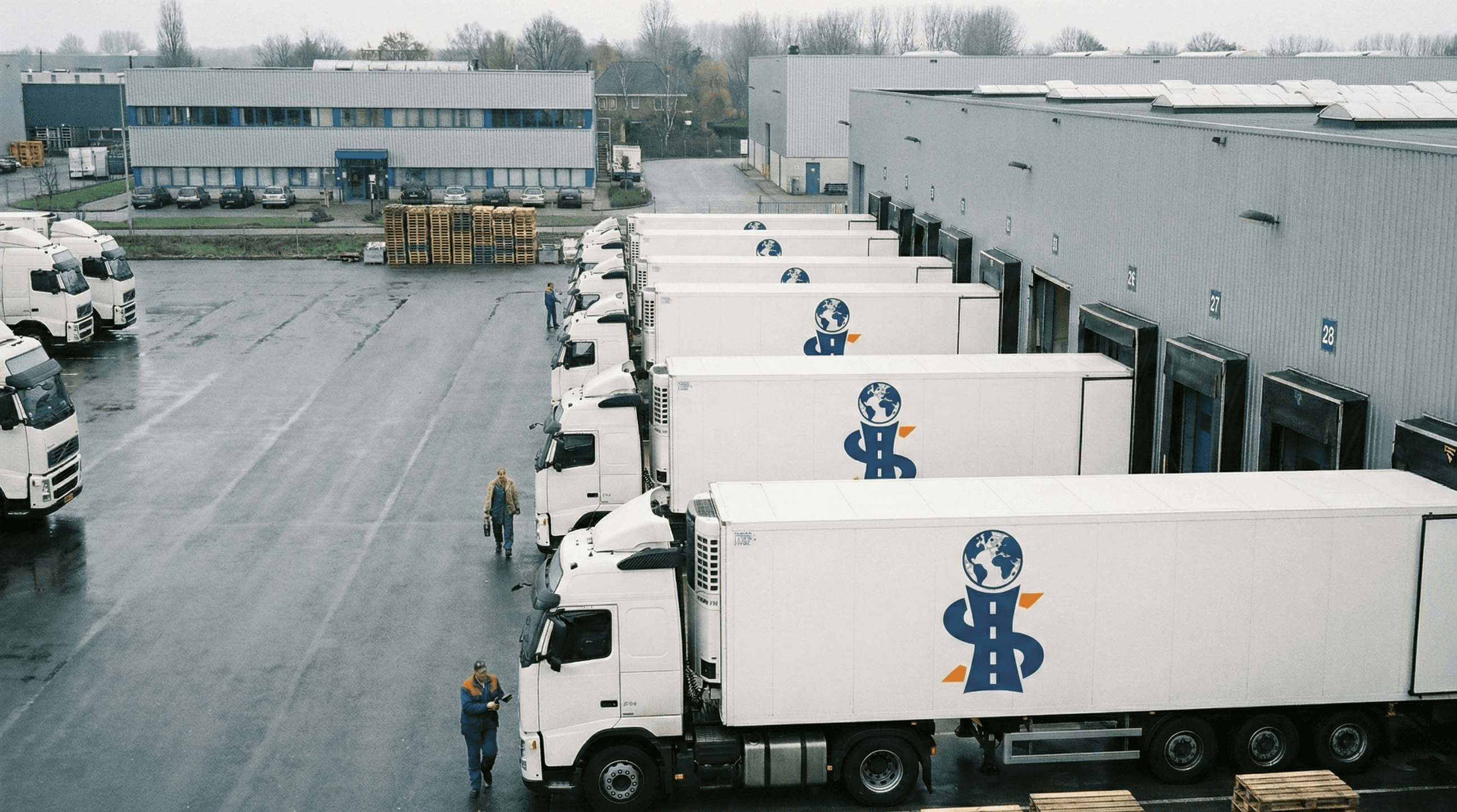 Man & woman stand in front of a few boxes