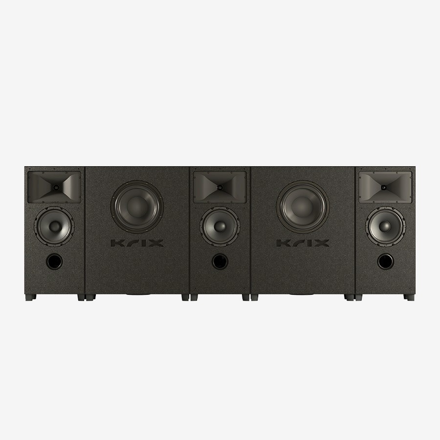 Five Klipsch speakers in a row on white background.