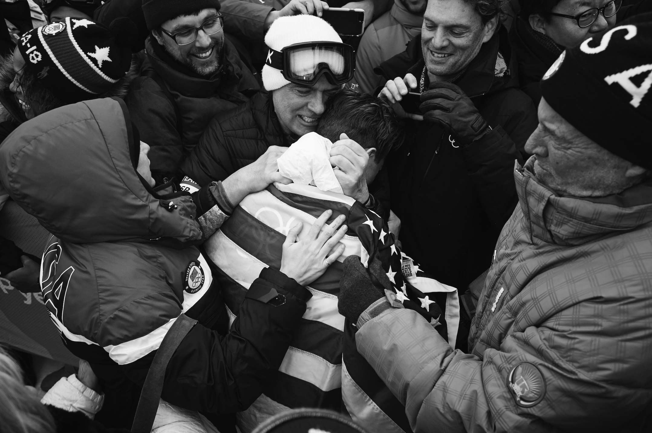 A fast black sports car races down the highway.