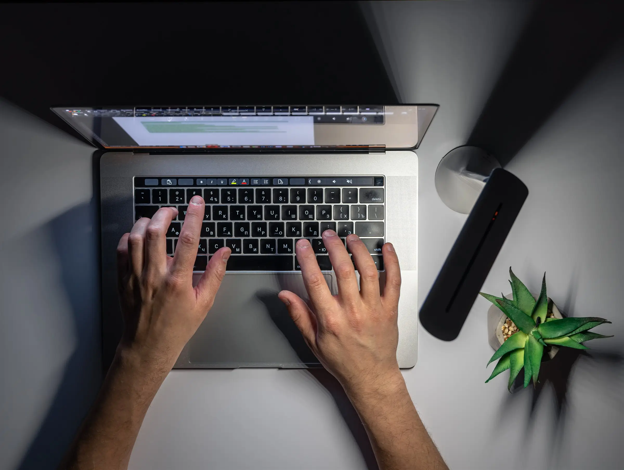 Overhead view of fast document processing on a laptop, KGT Solutions