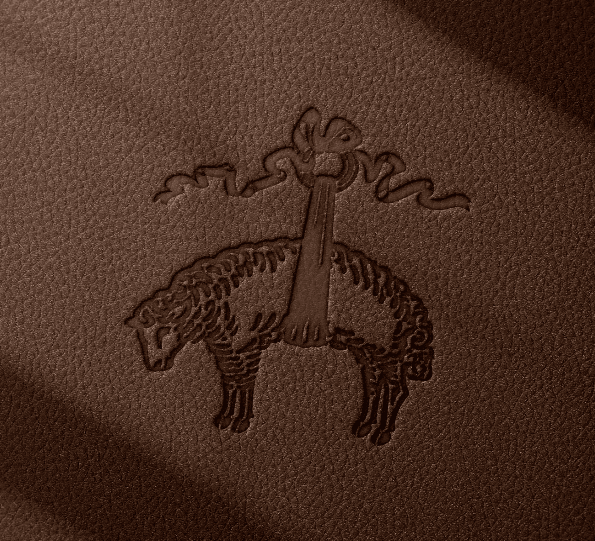 The Brooks Brothers log embossed in a rich brown piece of leather