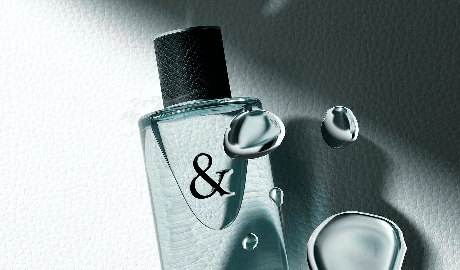 Luxury perfume bottle with water droplets on textured background.