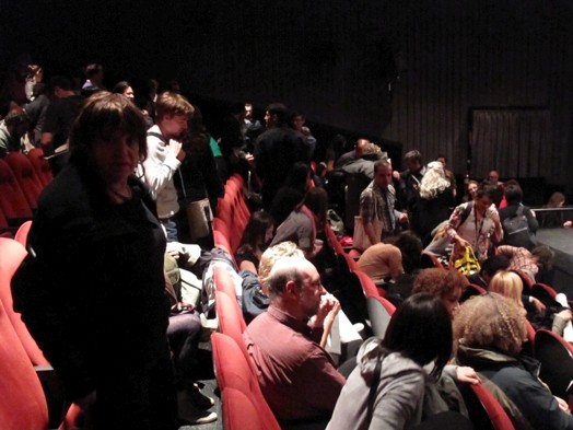 people occupying seats in the amphitheater