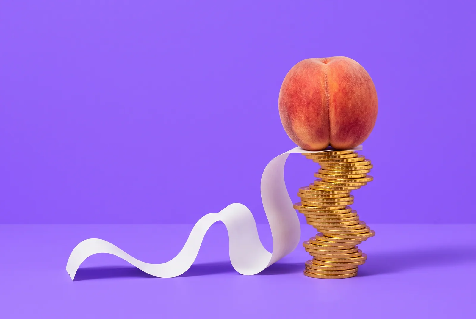 A peach on a tall wobbly stack of gold coins with a long blank receipt, signs of OnlyFans addiction and spending