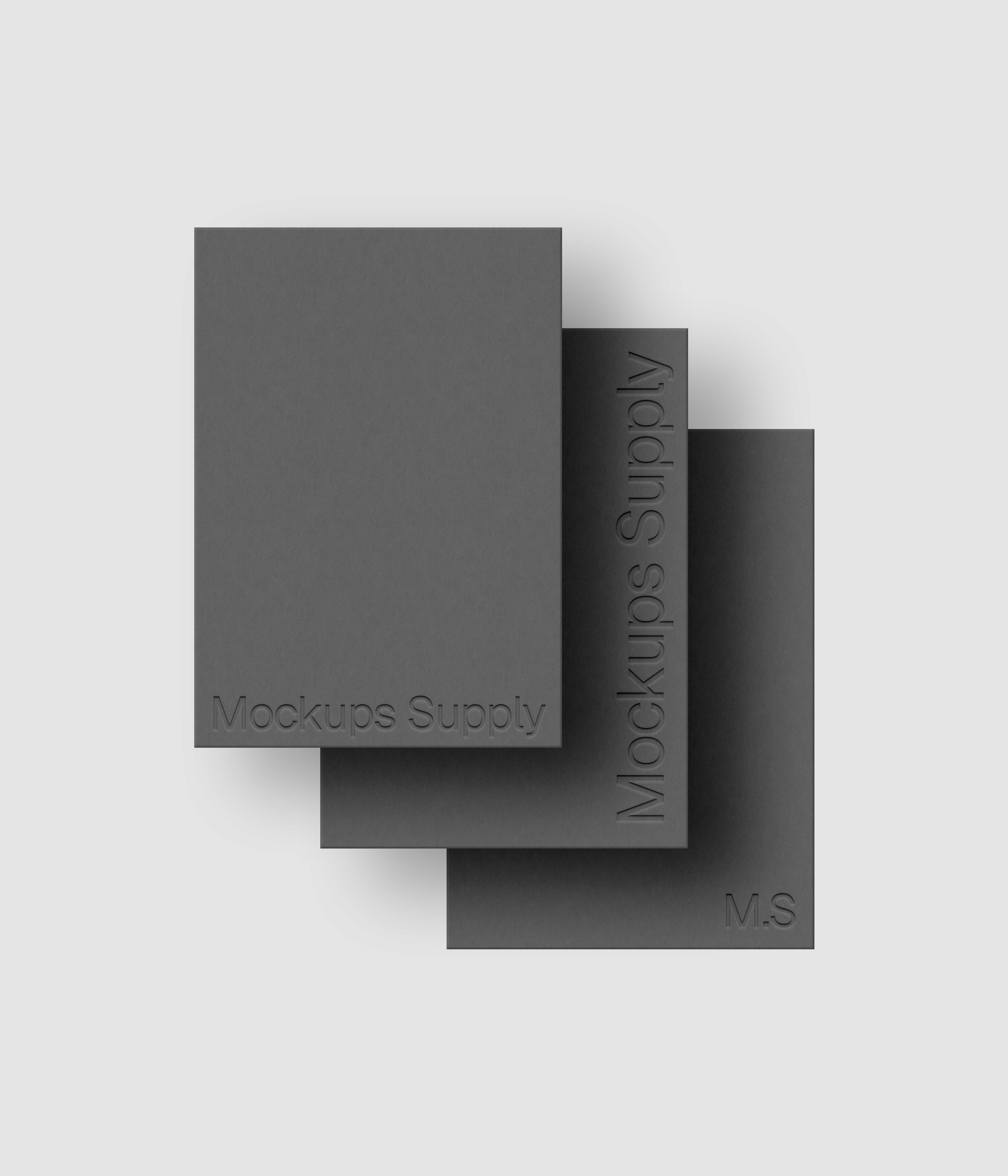 Three A5 paper mockup PSD portrait with debossed logo effect, gray papers on white background, modern minimal stationery mockup for print design and brand identity