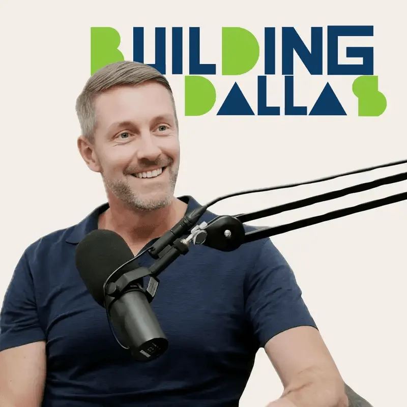 guest speaking into microphones with “Building Dallas” branding