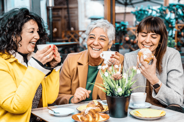 People enjoying espresso and pastries at a cafe in Italy