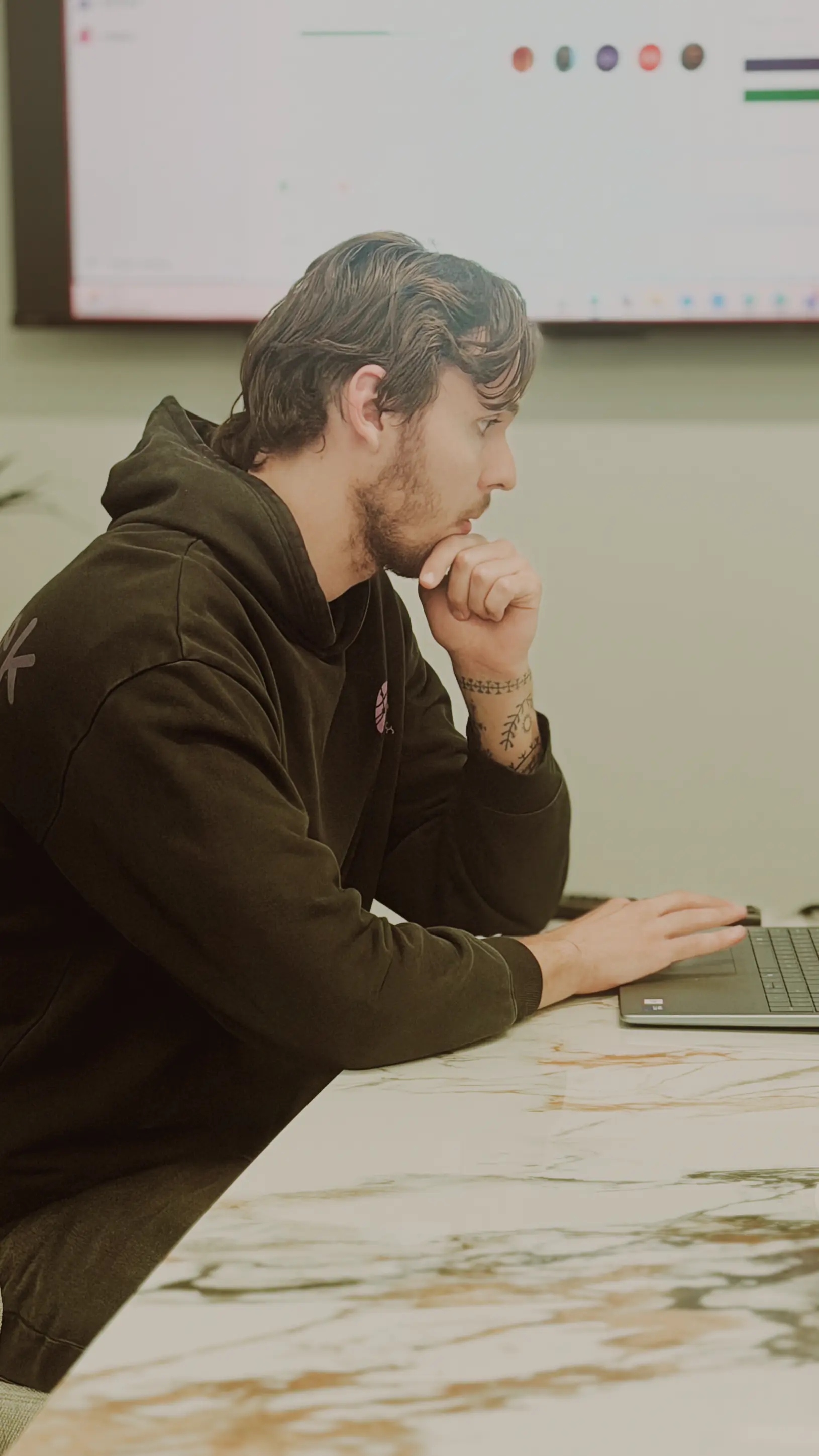 A team member reviewing work in a collaborative workspace