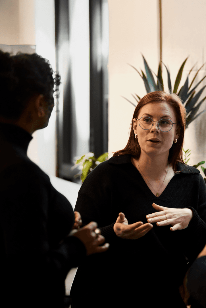 Member and physician discussing comprehensive health assessment results in a private suite at Biograph San Francisco.