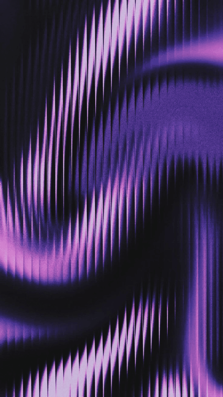 Layered blue mountains fade into a soft pink sky.