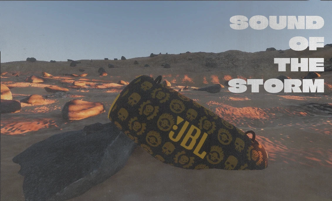 The JBL speaker half buried in the desert