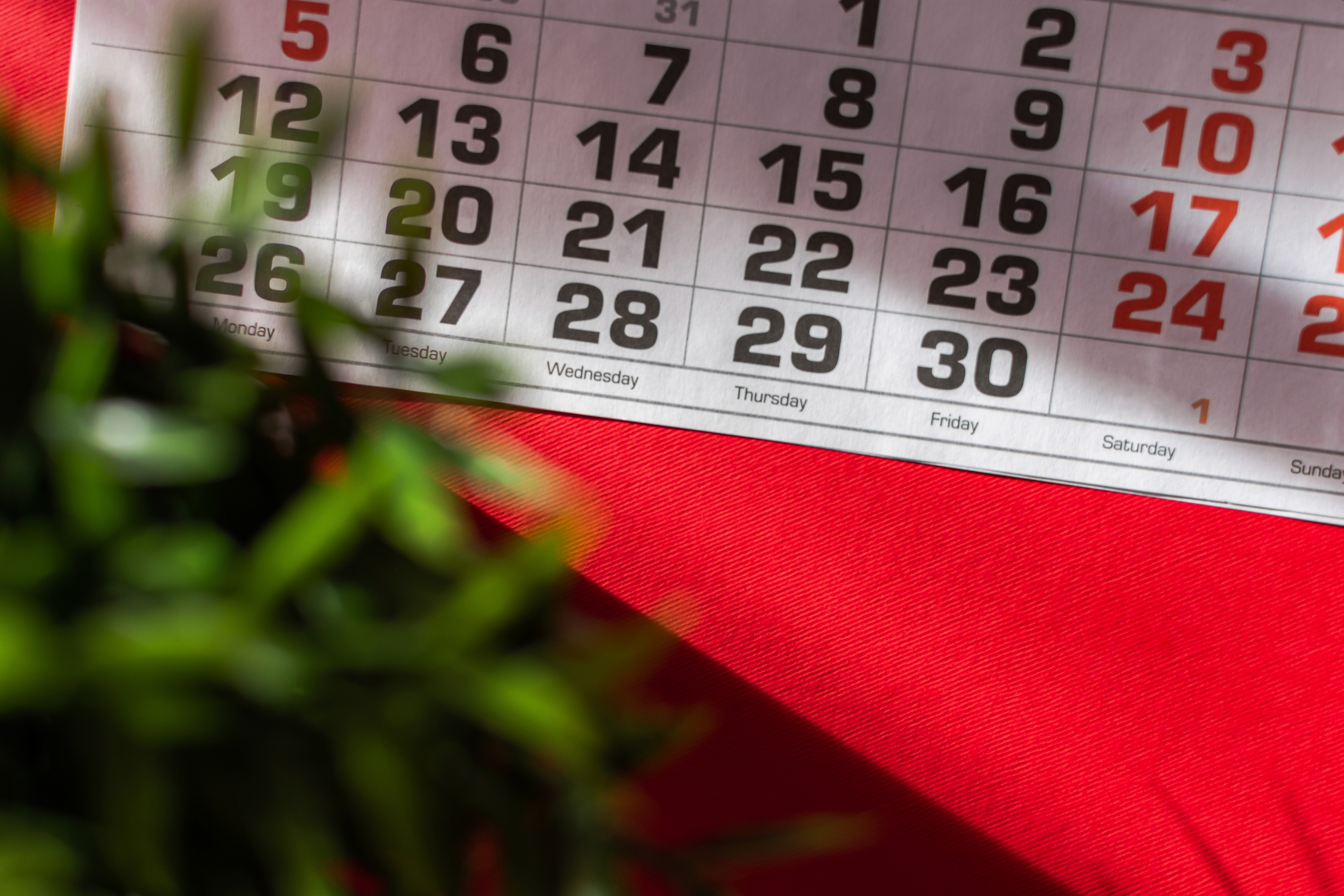 a man and a woman shaking hands in front of a laptop