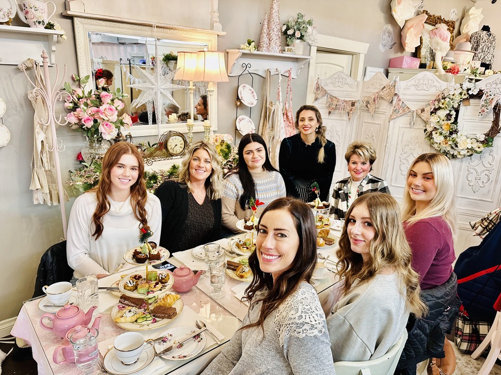 Ladies enjoying an exquisite afternoon tea service at the pink chandelier.