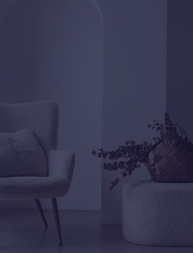 Modern minimalist chair and ottoman in a neutral-toned living space