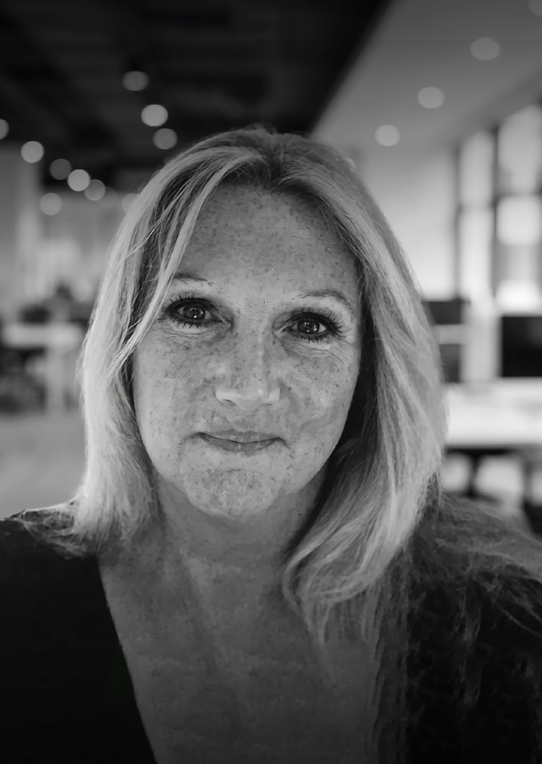a man smoking a cigarette in a black and white photo