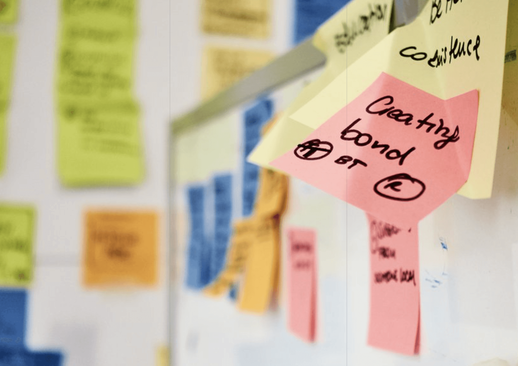 two people looking at a tablet and smiling