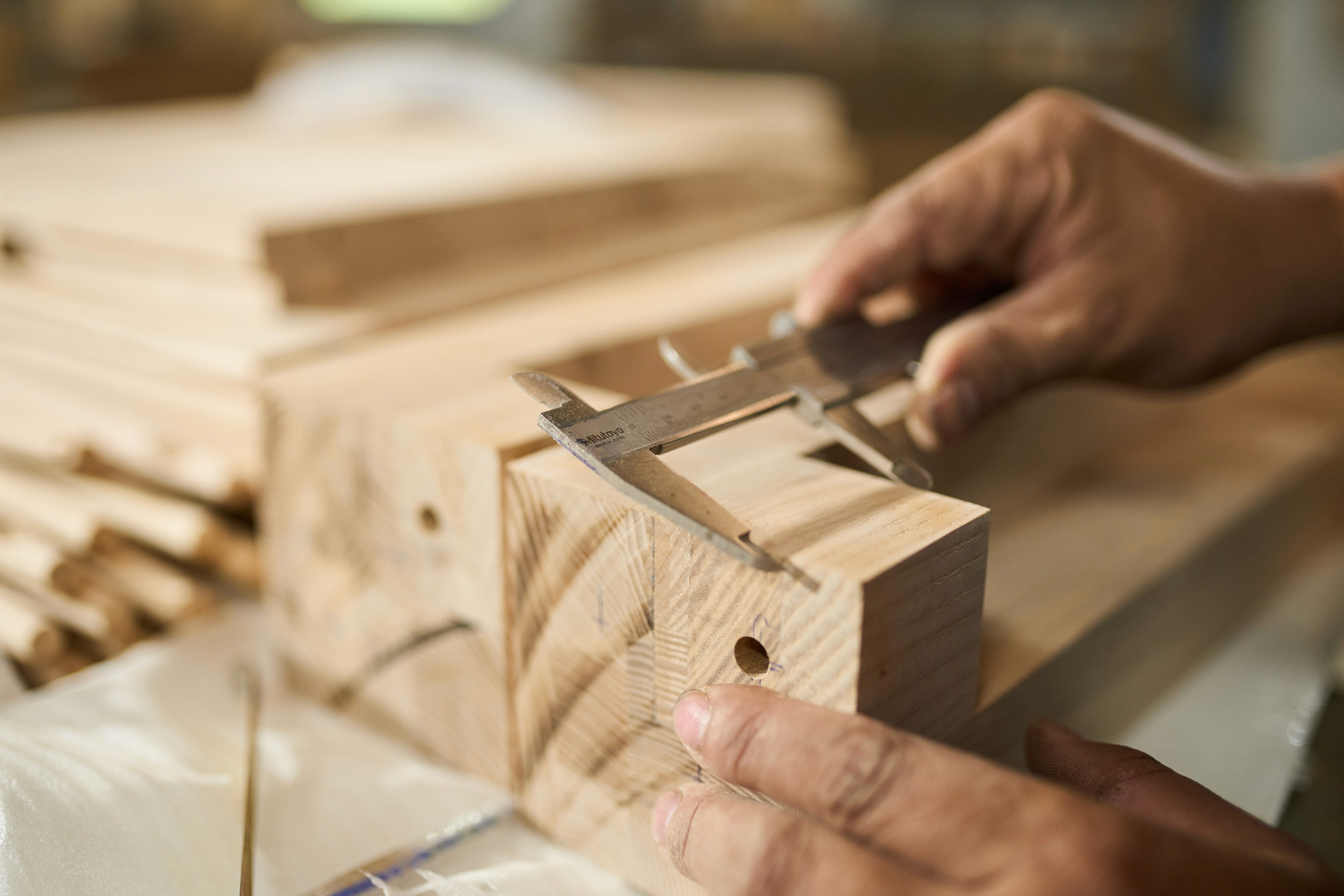 two gray pencils on yellow surface