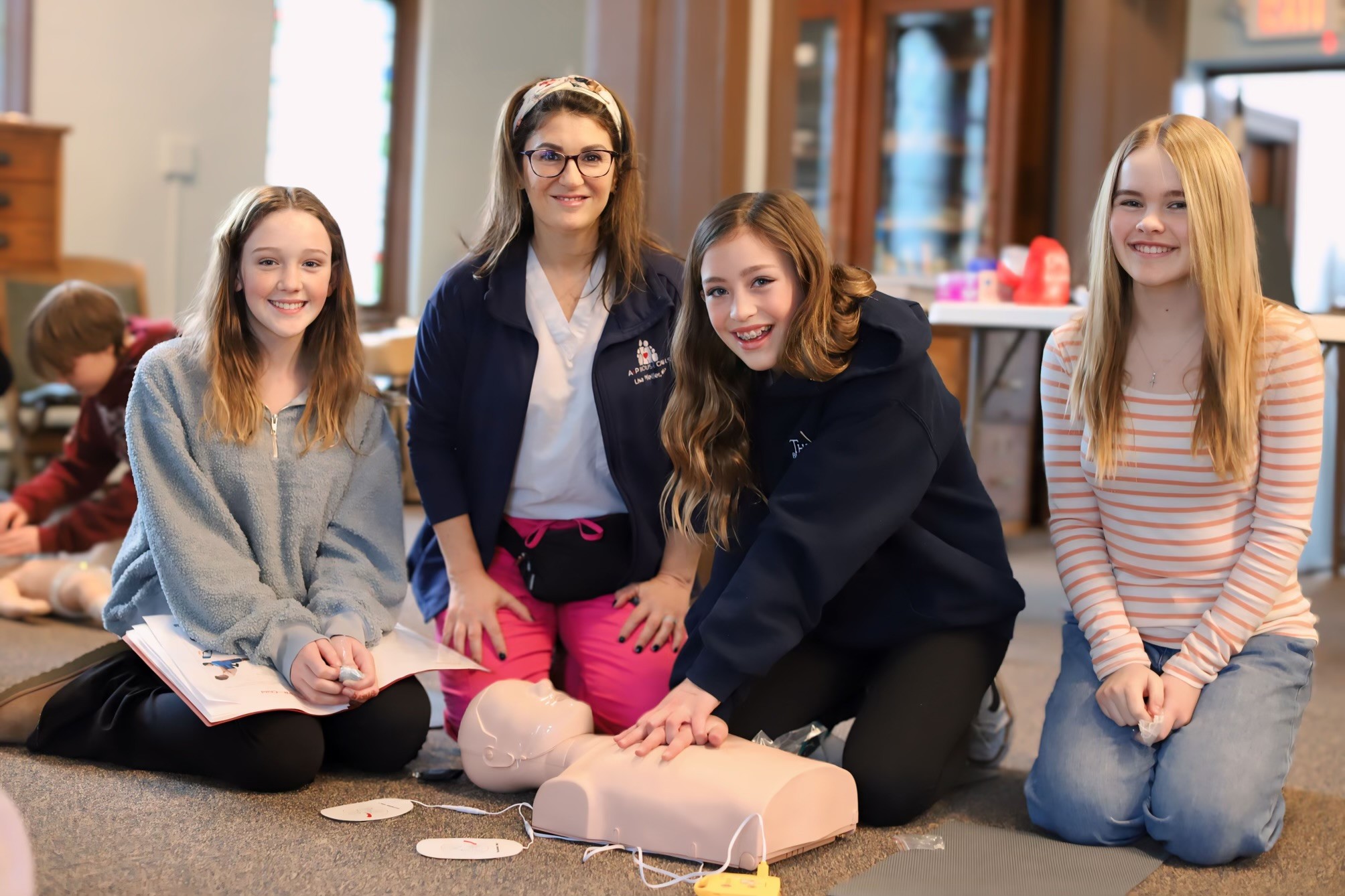 A+P House Calls Red Cross certified CPR and First Aid training class at home on Long Island — group session led by pediatric nurse practitioner