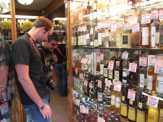 A photo of a merchandise shop with different vine bottles.