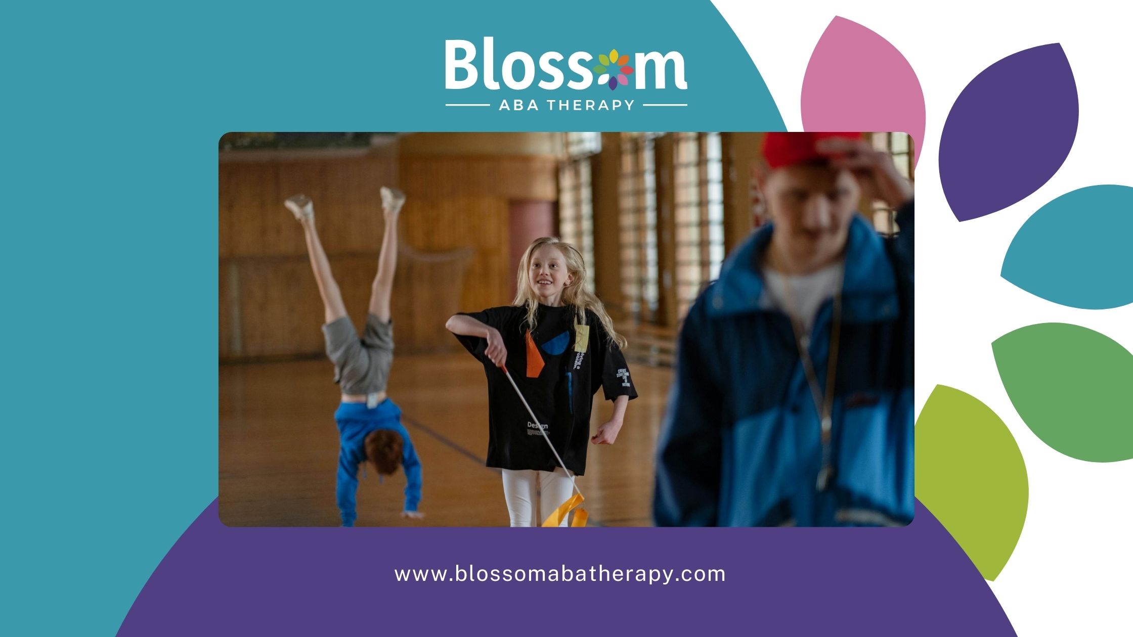 An autistic girl smiling while twirling a gymnastics ribbon during a practice at a school gym in TN.