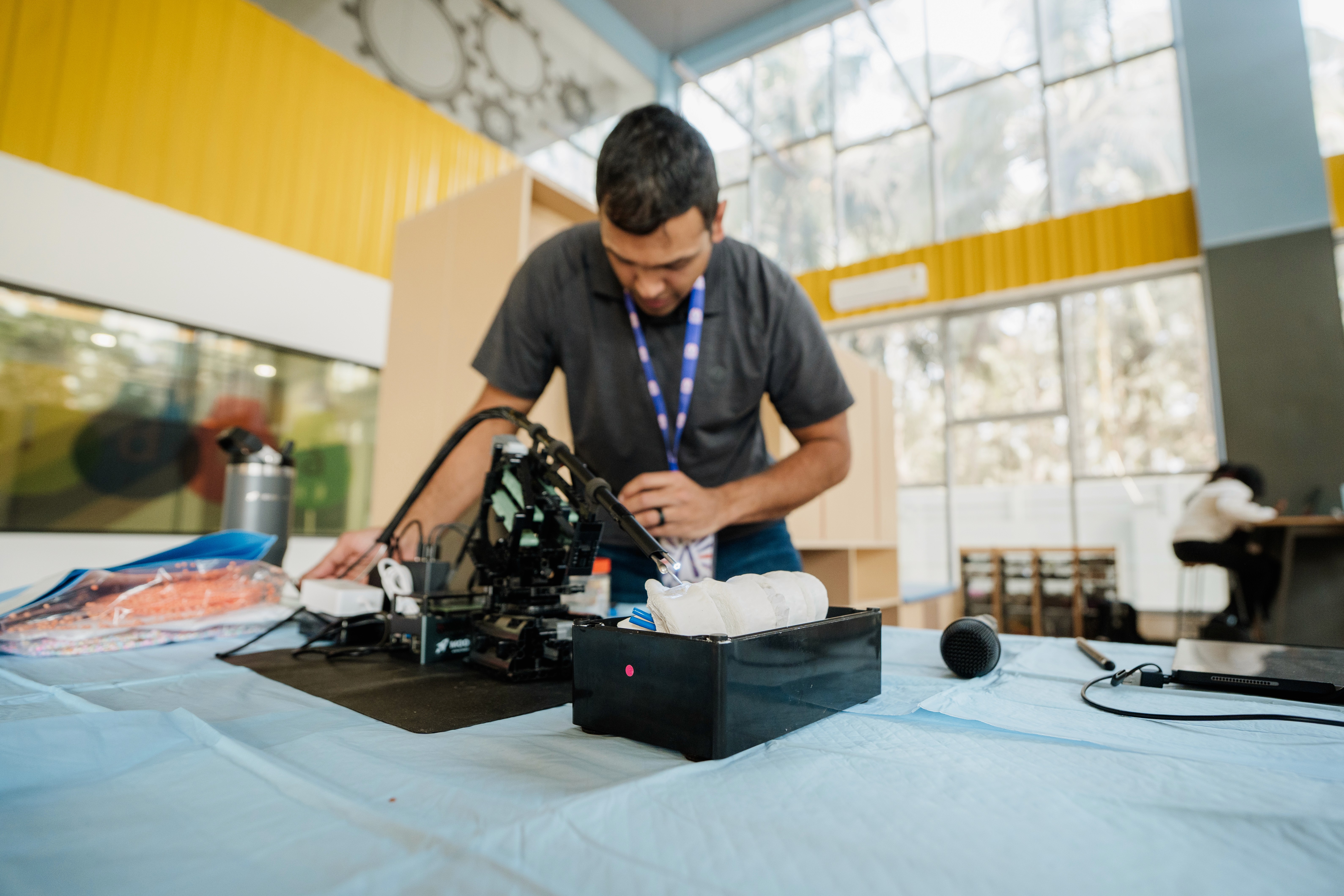 Teacher demonstrating robotics in technology-enabled classroom
