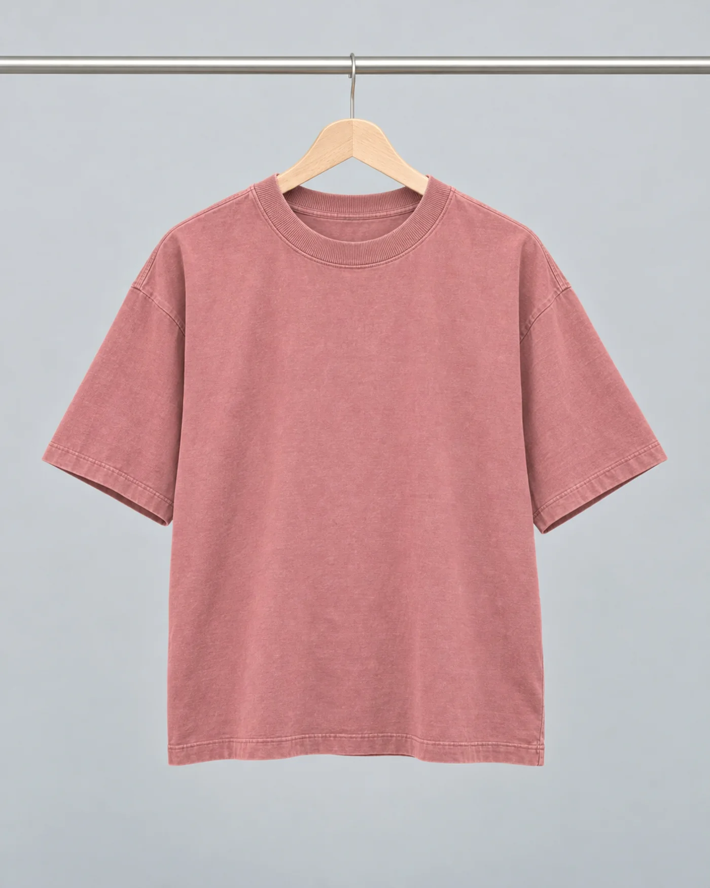 The rose heavy tee on a wooden hanger