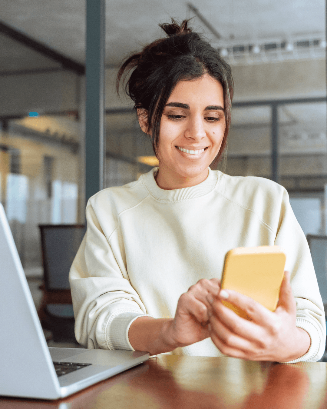 Woman reviewing network audit report on her mobile