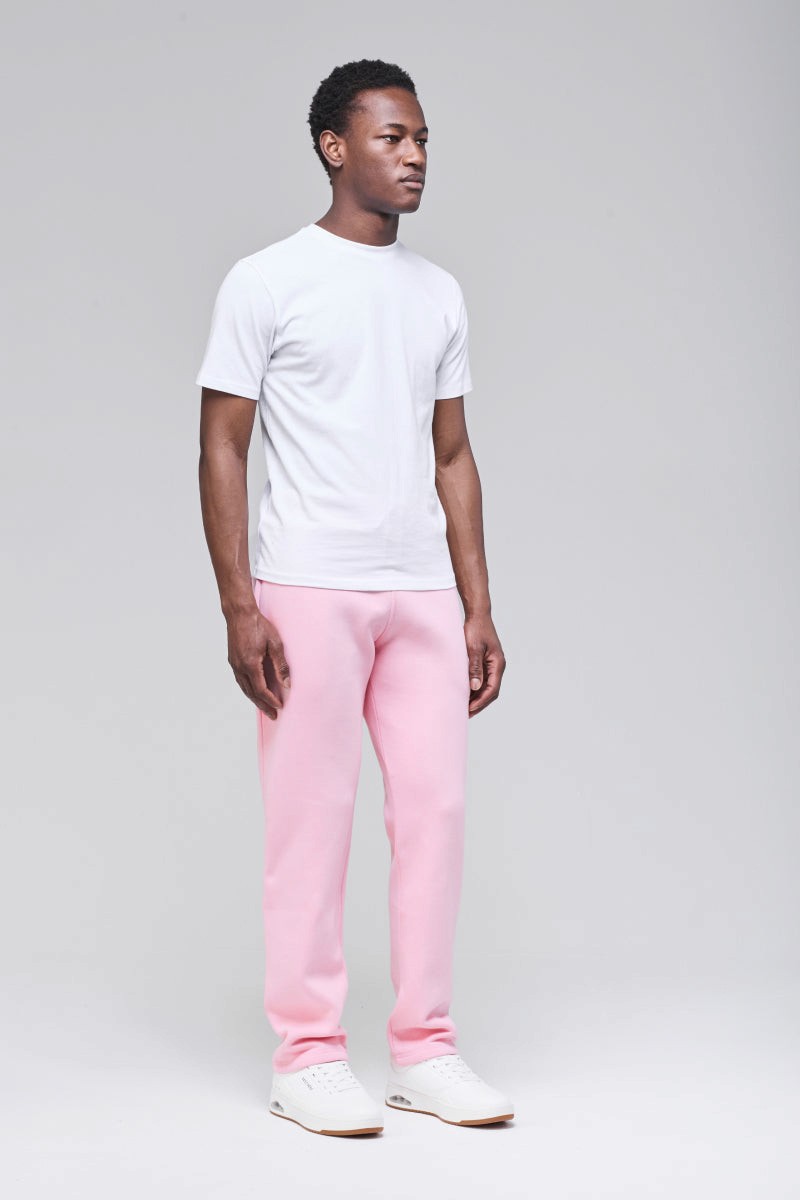Soft pink unisex sweatpants, angled front view