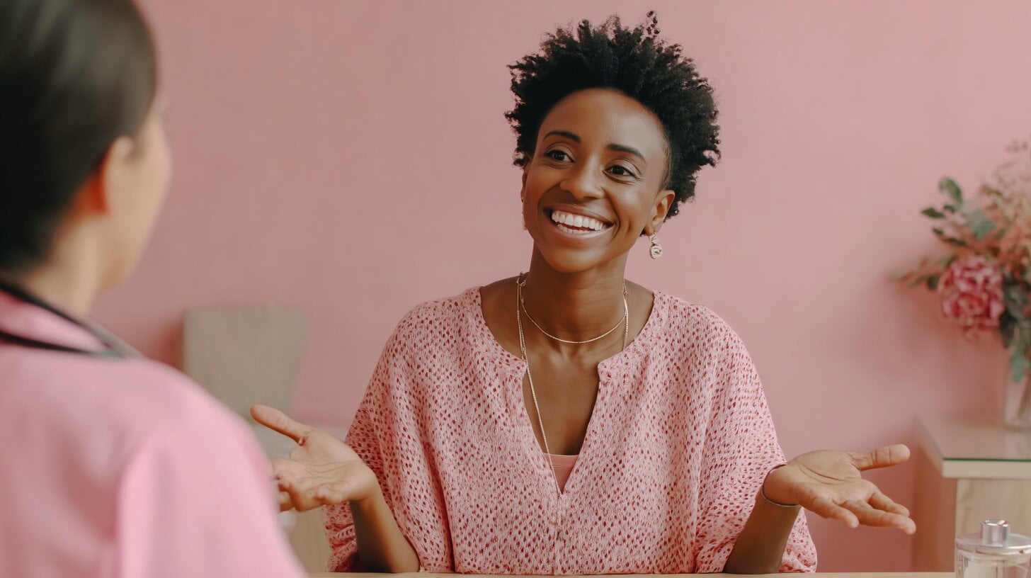 Black woman speaks with her doctor