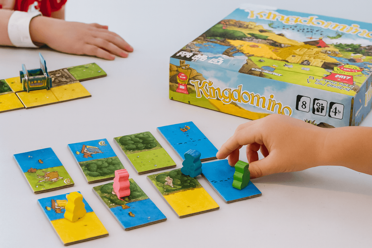Kids playing Kingdomino