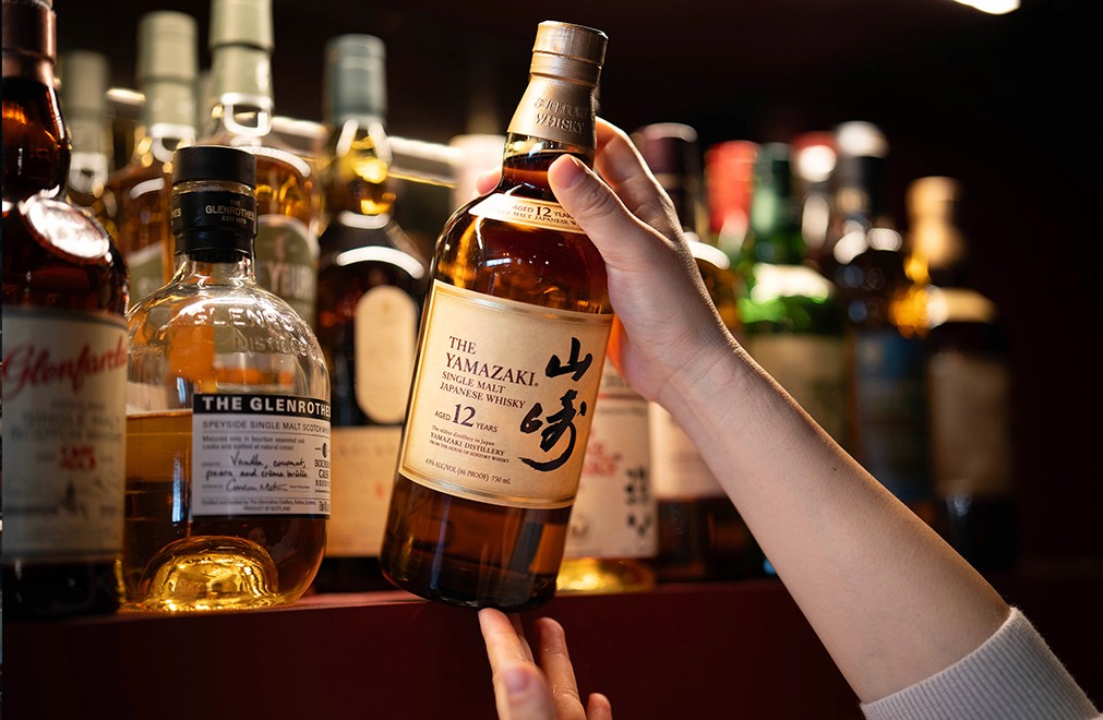 Streetside billboard with flyposters of the Batch.Works brand and illustrations